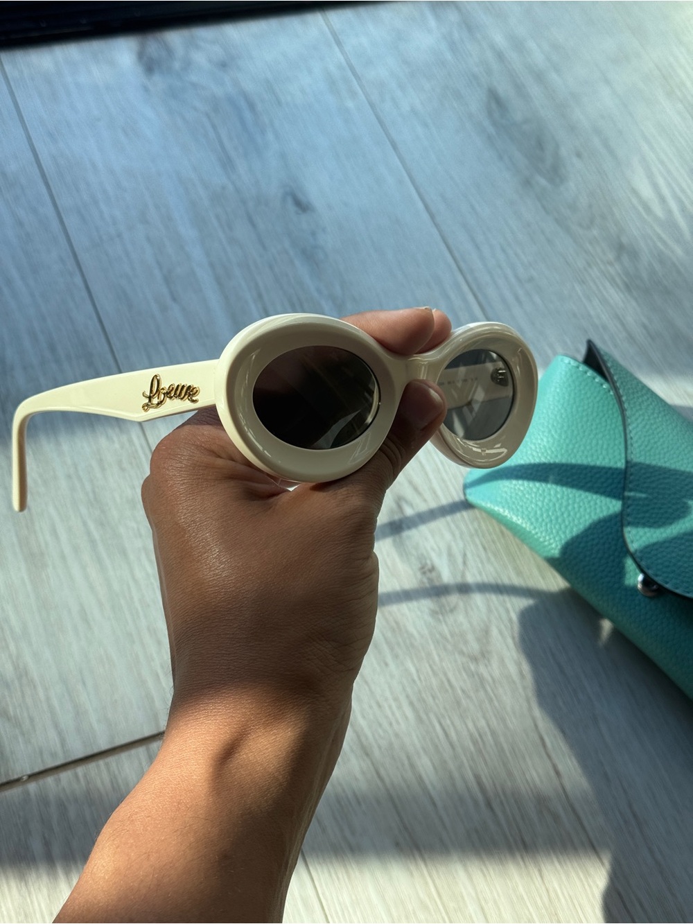 Loewe Ivory Oval Sunglasses with Dark Lenses